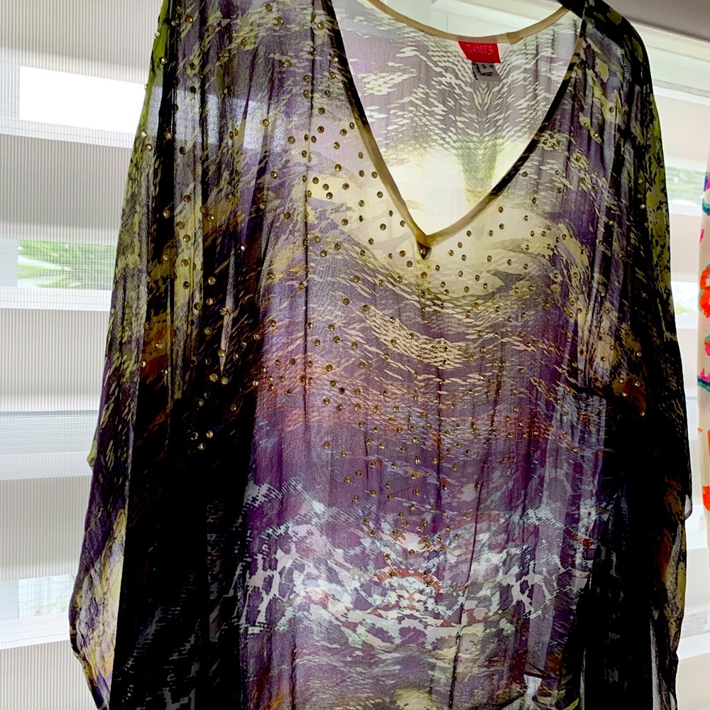 Dressy blouse with shiny rhinestones. Fits various sizes from 2 to 8